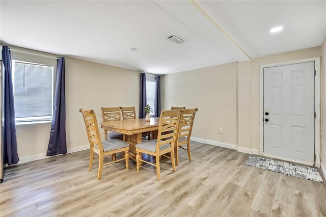 7308 Maryland Ave, Hudson, FL 34667 - dining area featuring light wood finished floors and baseboards