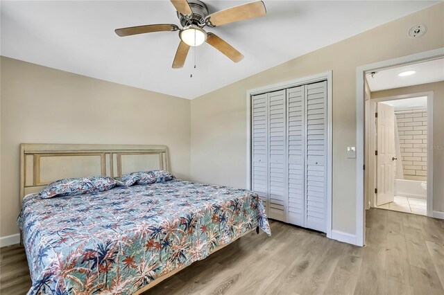 7308 Maryland Ave, Hudson, FL 34667 - bedroom featuring wood finished floors, a closet, baseboards, and a ceiling fan