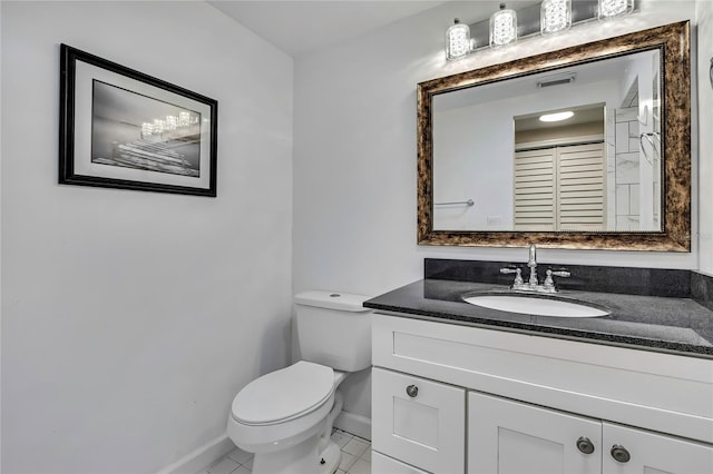 7308 Maryland Ave, Hudson, FL 34667 - half bathroom featuring baseboards, toilet, vanity, and tile patterned flooring