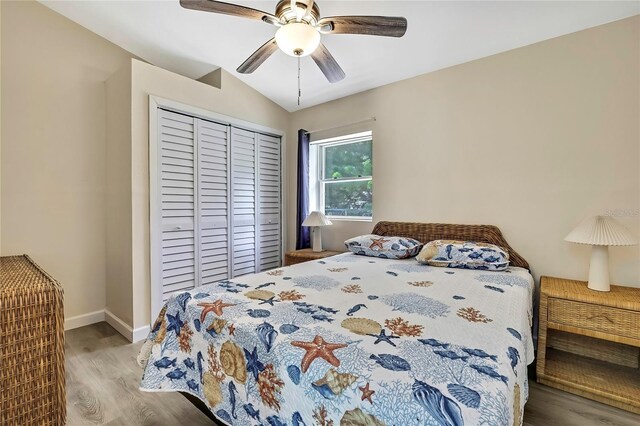 7308 Maryland Ave, Hudson, FL 34667 - bedroom featuring wood finished floors, a closet, baseboards, and a ceiling fan