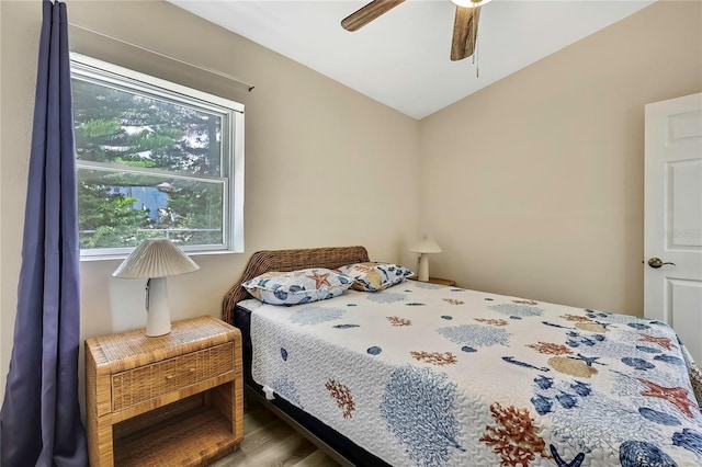 7308 Maryland Ave, Hudson, FL 34667 - bedroom featuring wood finished floors, vaulted ceiling, and ceiling fan