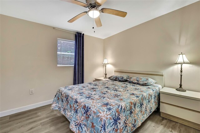 7308 Maryland Ave, Hudson, FL 34667 - bedroom with wood finished floors, baseboards, and a ceiling fan
