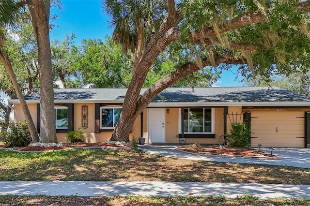 4468 Maraldo Ave, North Port, FL 34287 - ranch-style house with stucco siding, a garage, and concrete driveway