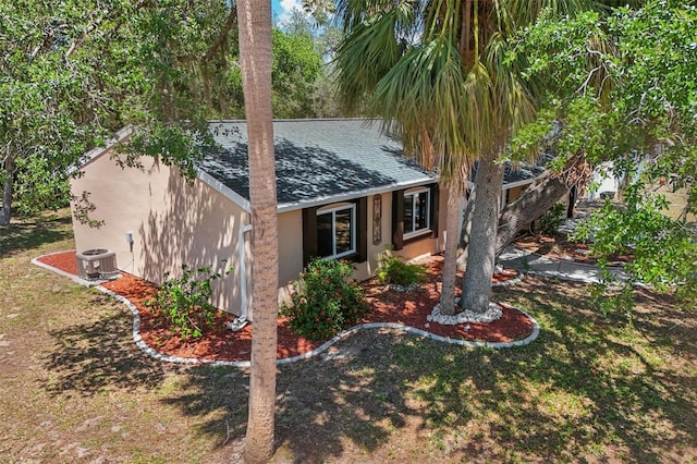 4468 Maraldo Ave, North Port, FL 34287 - view of front of property featuring stucco siding, a shingled roof, and cooling unit