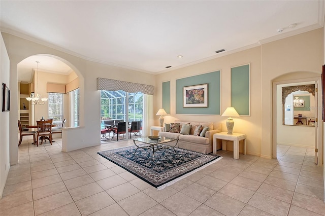 766 Shadow Bay Way, Osprey, FL 34229 - living area with ornamental molding, light tile patterned flooring, arched walkways, and a chandelier