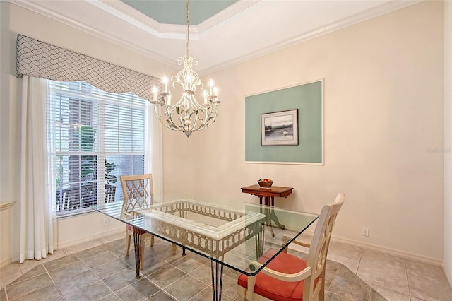 766 Shadow Bay Way, Osprey, FL 34229 - dining space featuring a chandelier, ornamental molding, tile patterned flooring, and a tray ceiling