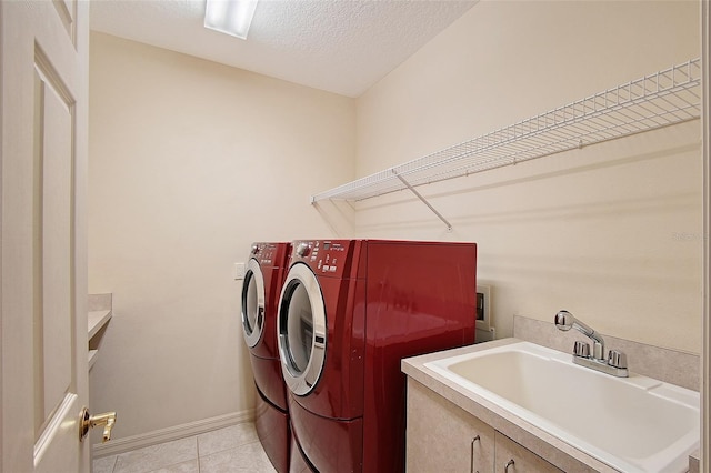 766 Shadow Bay Way, Osprey, FL 34229 - laundry area with separate washer and dryer, light tile patterned floors, and a textured ceiling