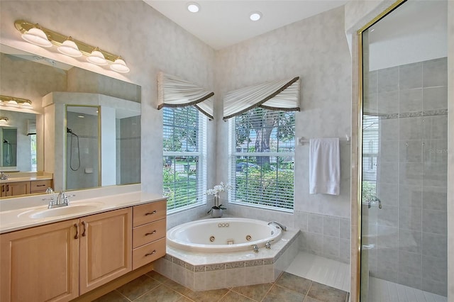 766 Shadow Bay Way, Osprey, FL 34229 - full bathroom featuring a shower stall, a jetted tub, vanity, and tile patterned floors