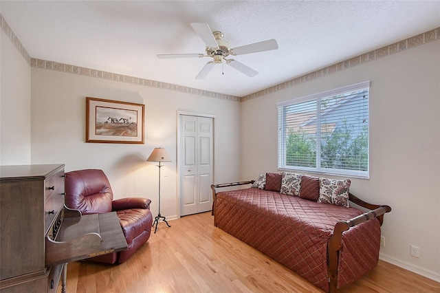 766 Shadow Bay Way, Osprey, FL 34229 - bedroom with light wood finished floors, a ceiling fan, and a closet