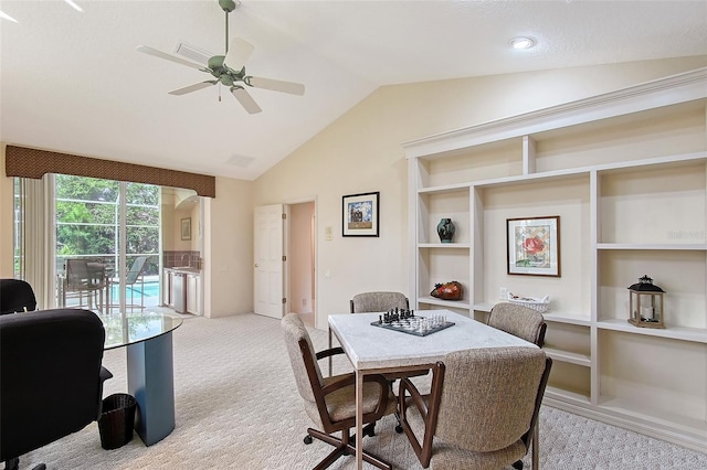 766 Shadow Bay Way, Osprey, FL 34229 - dining space with lofted ceiling, light colored carpet, ceiling fan, a desk, and built in features