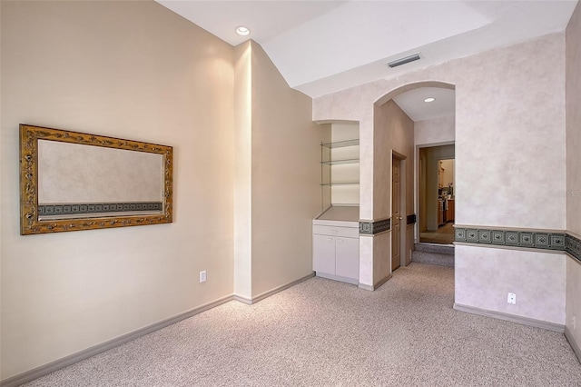 766 Shadow Bay Way, Osprey, FL 34229 - unfurnished room featuring arched walkways, light carpet, and recessed lighting