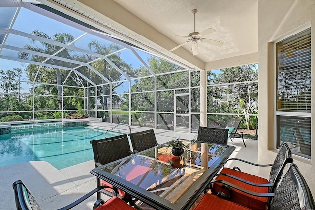 766 Shadow Bay Way, Osprey, FL 34229 - view of swimming pool with ceiling fan, a patio, outdoor dining area, a lanai, and a pool with connected hot tub