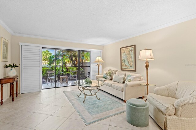 1001 Benjamin Franklin Dr Unit 106, Sarasota, FL 34236 - living area featuring crown molding, a textured ceiling, and light tile patterned floors