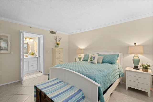 1001 Benjamin Franklin Dr Unit 106, Sarasota, FL 34236 - bedroom with light tile patterned floors, crown molding, baseboards, connected bathroom, and a textured ceiling