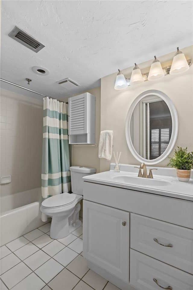 1001 Benjamin Franklin Dr Unit 106, Sarasota, FL 34236 - full bath with vanity, tile patterned floors, toilet, shower / tub combo, and a textured ceiling