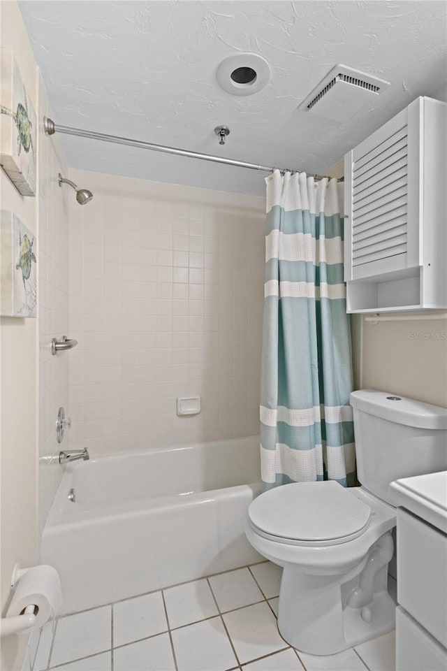 1001 Benjamin Franklin Dr Unit 106, Sarasota, FL 34236 - full bathroom with shower / tub combo with curtain, tile patterned flooring, vanity, and toilet