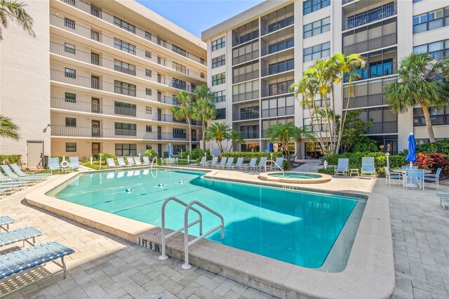 1001 Benjamin Franklin Dr Unit 106, Sarasota, FL 34236 - community pool with a patio and a hot tub