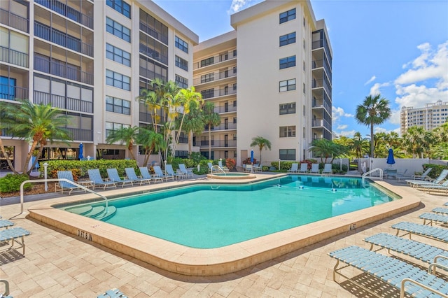 1001 Benjamin Franklin Dr Unit 106, Sarasota, FL 34236 - community pool with a patio area and a hot tub