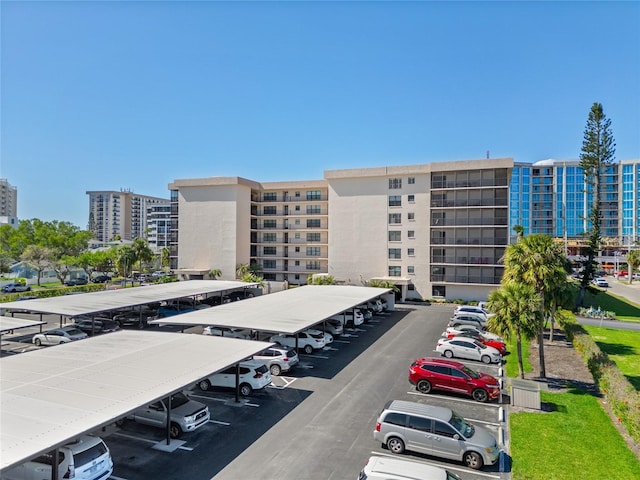 1001 Benjamin Franklin Dr Unit 106, Sarasota, FL 34236 - view of building exterior with uncovered parking