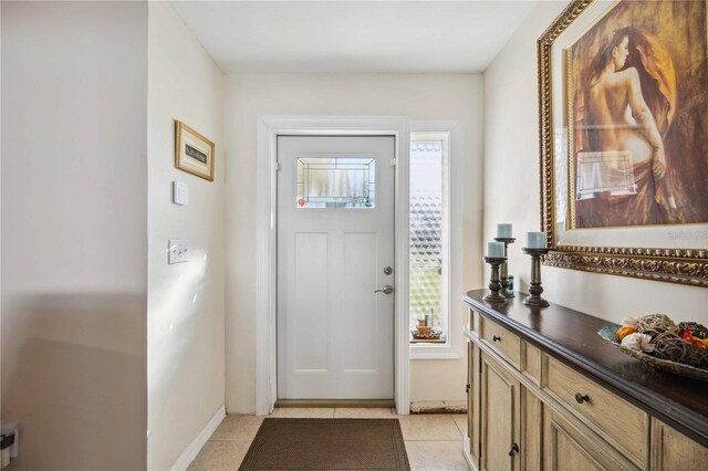 5808 SW 1st Pl, Cape Coral, FL 33914 - foyer with light tile patterned floors and baseboards