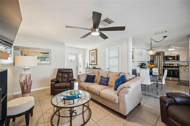 5808 SW 1st Pl, Cape Coral, FL 33914 - living area featuring ceiling fan, light tile patterned floors, and baseboards