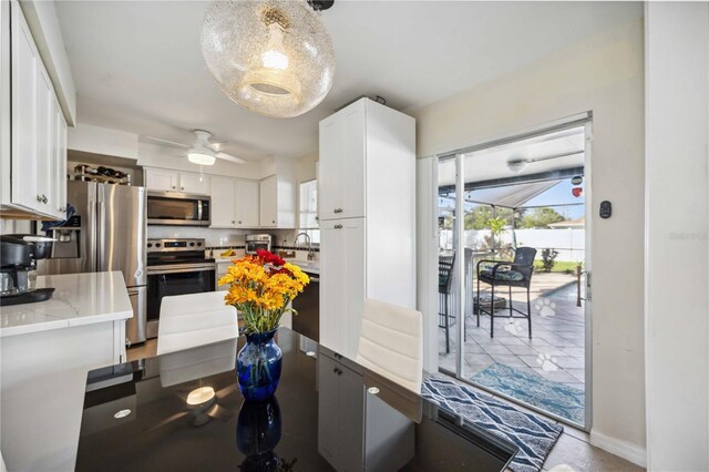 5808 SW 1st Pl, Cape Coral, FL 33914 - dining space featuring ceiling fan