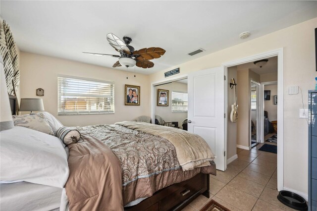 5808 SW 1st Pl, Cape Coral, FL 33914 - bedroom featuring light tile patterned flooring, ceiling fan, a closet, and baseboards