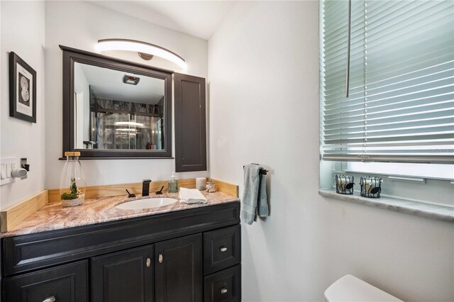 5808 SW 1st Pl, Cape Coral, FL 33914 - bathroom featuring vanity, a shower stall, and toilet