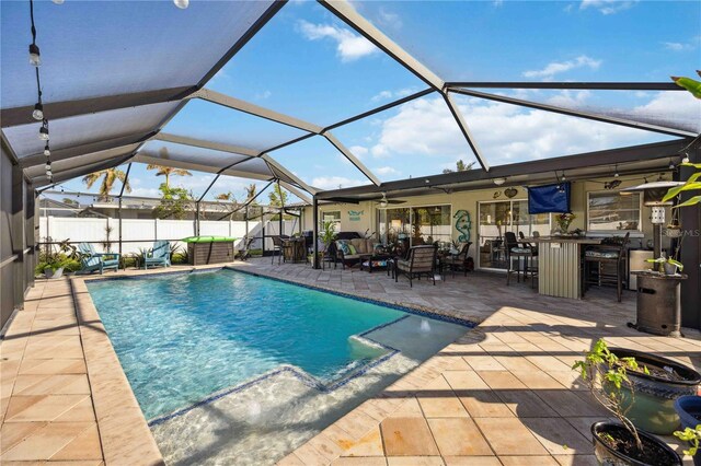 5808 SW 1st Pl, Cape Coral, FL 33914 - view of swimming pool featuring a ceiling fan, a patio area, an outdoor hangout area, fence, and a lanai