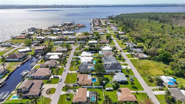 5808 SW 1st Pl, Cape Coral, FL 33914 - aerial view of property's location with nearby suburban area, a large body of water, and a forest