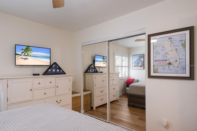 5623 Midnight Pass Rd Unit 615, Sarasota, FL 34242 - bedroom with wood finished floors, a closet, and a ceiling fan