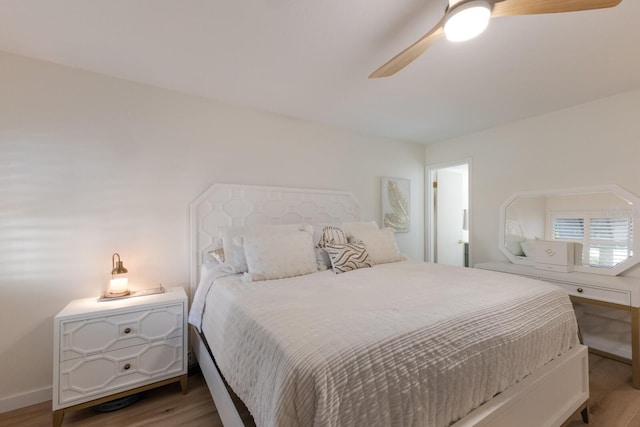 5623 Midnight Pass Rd Unit 615, Sarasota, FL 34242 - bedroom featuring wood finished floors, baseboards, and a ceiling fan