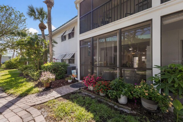 5623 Midnight Pass Rd Unit 615, Sarasota, FL 34242 - view of exterior entry featuring central air condition unit