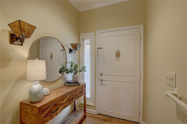 5039 Kestral Park Dr Unit 67, Sarasota, FL 34231 - entrance foyer featuring ornamental molding, light wood finished floors, and baseboards