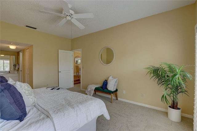 5039 Kestral Park Dr Unit 67, Sarasota, FL 34231 - bedroom with carpet, baseboards, a textured ceiling, a closet, and a ceiling fan