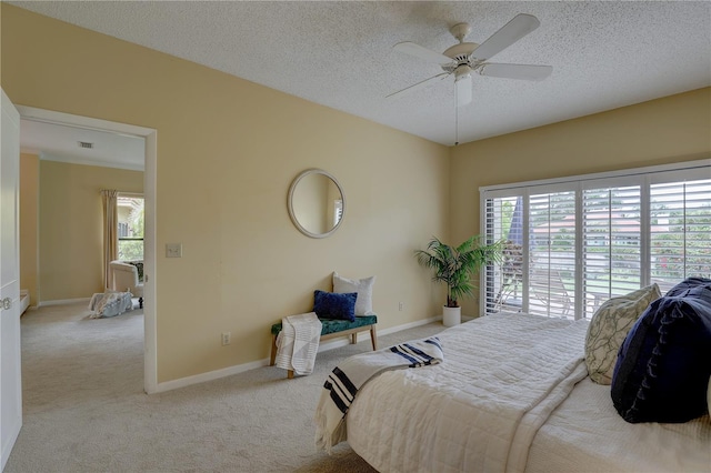 5039 Kestral Park Dr Unit 67, Sarasota, FL 34231 - bedroom with carpet, a textured ceiling, baseboards, and a ceiling fan