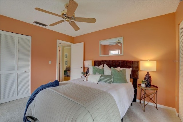 5039 Kestral Park Dr Unit 67, Sarasota, FL 34231 - bedroom with light colored carpet, a closet, baseboards, and ceiling fan