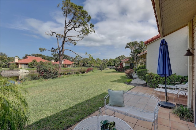 5039 Kestral Park Dr Unit 67, Sarasota, FL 34231 - view of grassy yard featuring a patio area