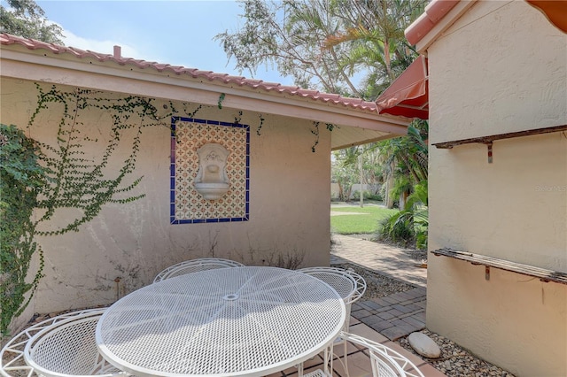 5039 Kestral Park Dr Unit 67, Sarasota, FL 34231 - view of patio / terrace with outdoor dining space