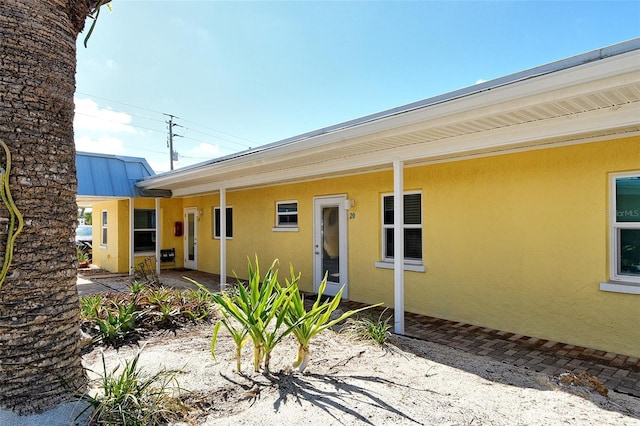105 Casey Key Rd Unit 20, Nokomis, FL 34275 - back of house featuring stucco siding