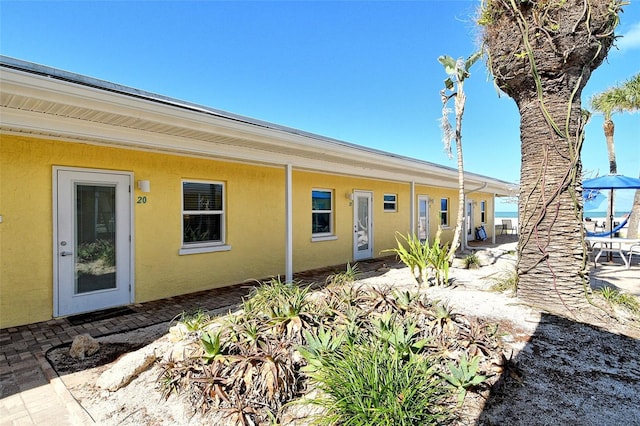 105 Casey Key Rd Unit 20, Nokomis, FL 34275 - back of house featuring stucco siding