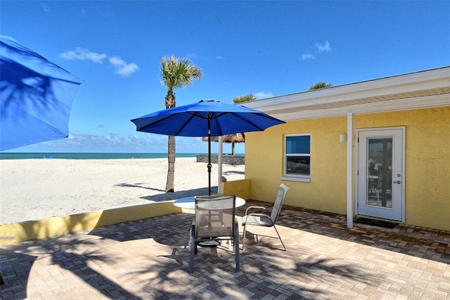 105 Casey Key Rd Unit 20, Nokomis, FL 34275 - view of patio / terrace with view of water and beach