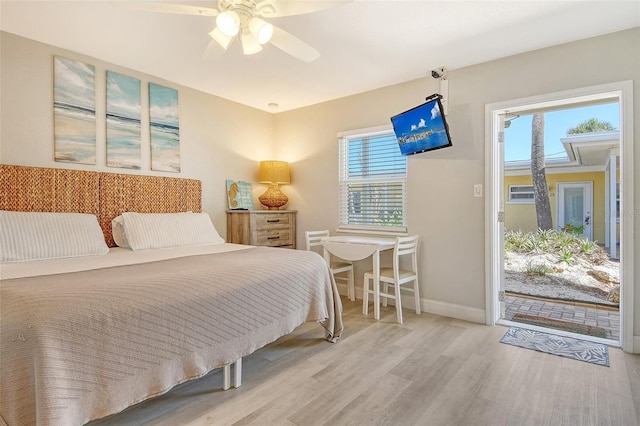 105 Casey Key Rd Unit 20, Nokomis, FL 34275 - bedroom featuring wood finished floors, multiple windows, baseboards, and ceiling fan