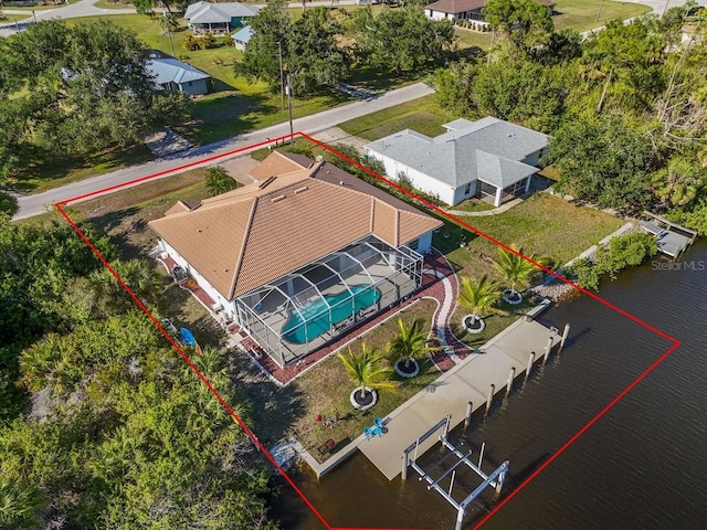 3620 Como St, Port Charlotte, FL 33948 - aerial view of residential area with property boundaries highlighted, a large body of water, and a pool area