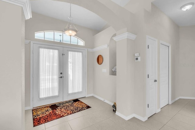 3620 Como St, Port Charlotte, FL 33948 - tiled entryway with arched walkways, baseboards, french doors, and high vaulted ceiling