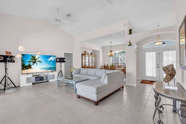 3620 Como St, Port Charlotte, FL 33948 - living area with tile patterned flooring, a chandelier, ceiling fan, and high vaulted ceiling
