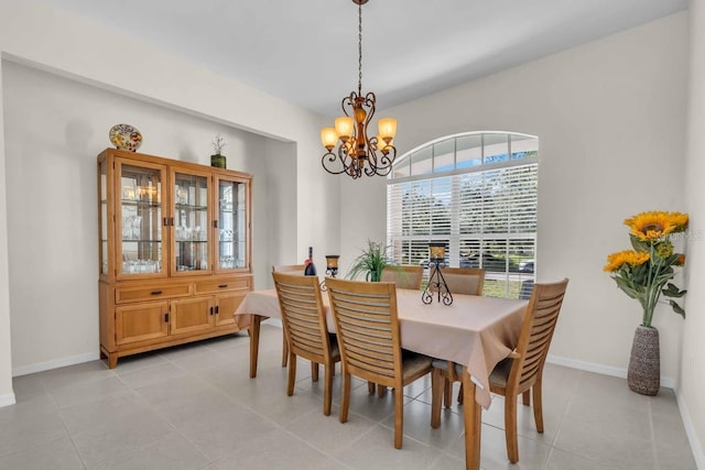 3620 Como St, Port Charlotte, FL 33948 - dining area featuring a chandelier, light tile patterned floors, and baseboards