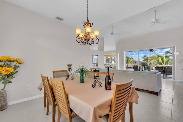3620 Como St, Port Charlotte, FL 33948 - dining space featuring light tile patterned floors, ceiling fan, a chandelier, baseboards, and lofted ceiling