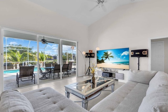 3620 Como St, Port Charlotte, FL 33948 - living area with a ceiling fan, a sunroom, vaulted ceiling, and tile patterned floors