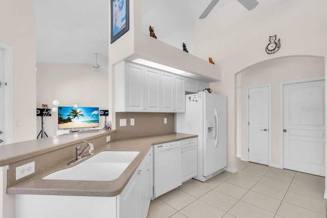 3620 Como St, Port Charlotte, FL 33948 - kitchen with white appliances, a sink, light tile patterned floors, ceiling fan, and white cabinets